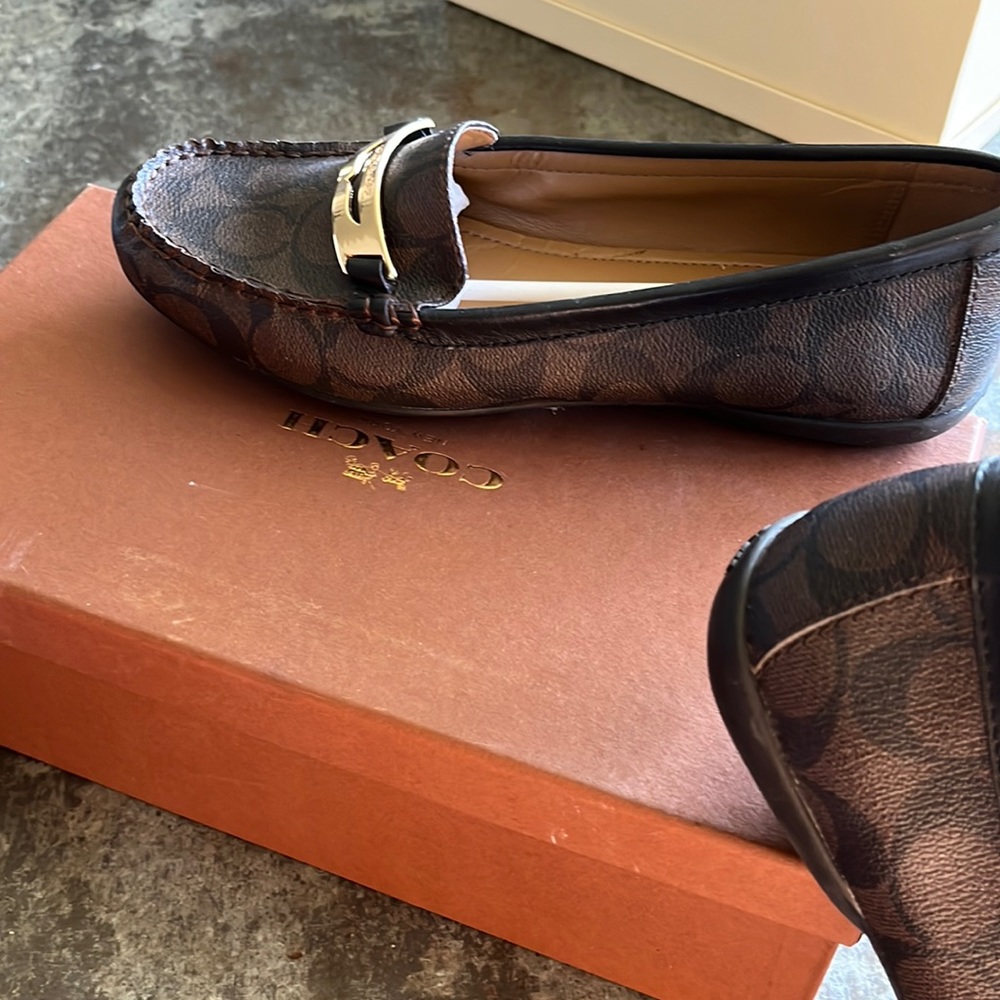 Coach brown-mahogany/black flats, size 9M. In original box.